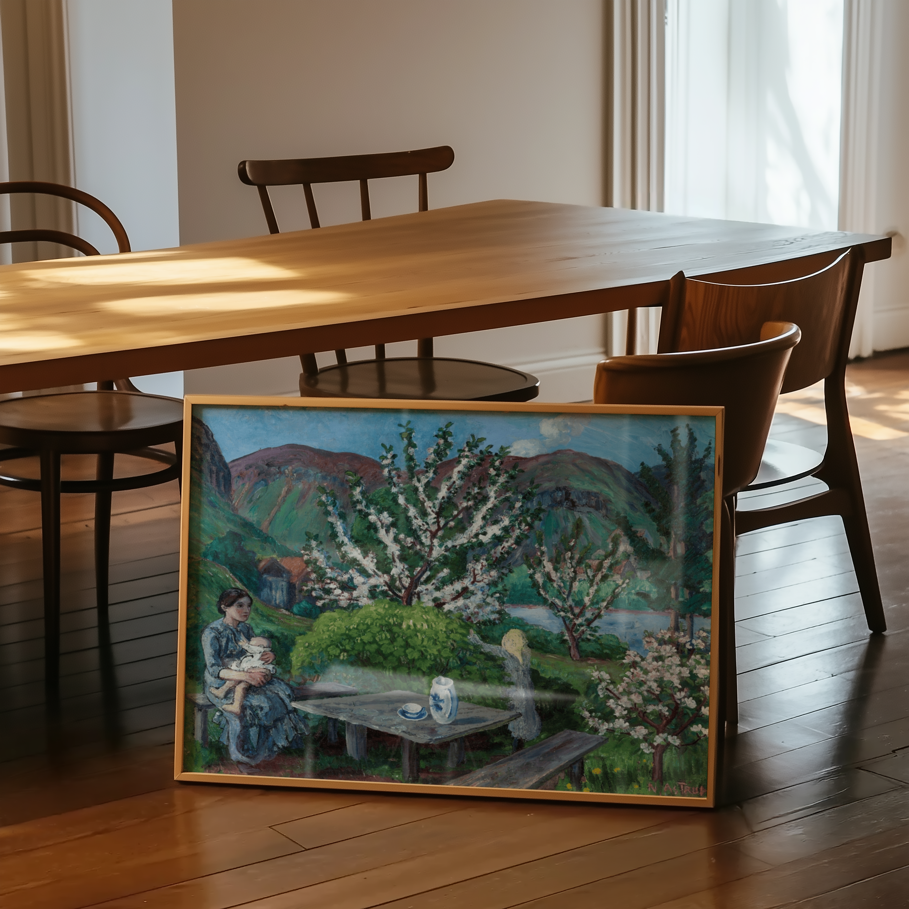 Nikolai Astrup - Mor og barn ved hagebordet